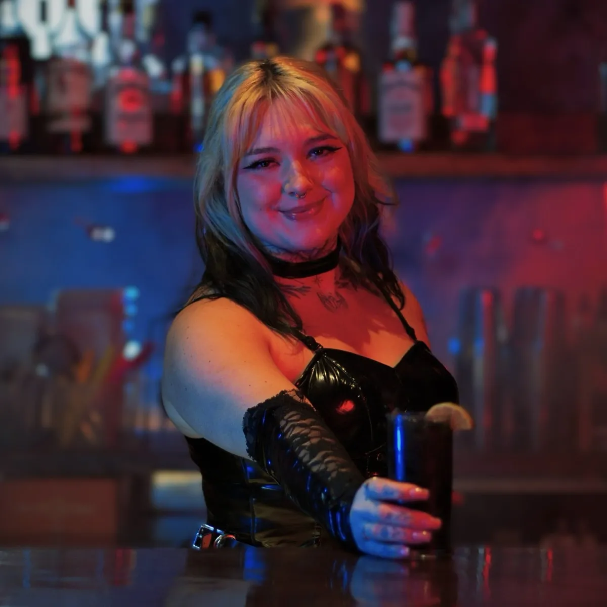 Bartender in blue and red light