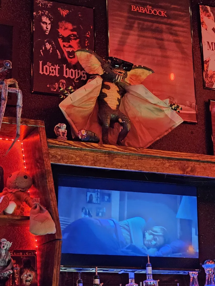 Gremlins figure with Lost Boys and Babadook posters